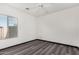 Bedroom with ceiling fan and dark gray vinyl flooring at 13407 N Primrose St, El Mirage, AZ 85335