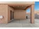 Covered patio with string lights, ideal for outdoor relaxation at 13407 N Primrose St, El Mirage, AZ 85335