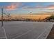 Outdoor basketball court with lighting, perfect for evening games at 14248 W Edgemont Ave, Goodyear, AZ 85395