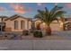 Single-story home with desert landscaping and a two-car garage at 14248 W Edgemont Ave, Goodyear, AZ 85395