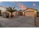 House exterior view with two-car garage and landscaping at 14248 W Edgemont Ave, Goodyear, AZ 85395