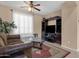 Living room with leather sofa and entertainment center at 14248 W Edgemont Ave, Goodyear, AZ 85395