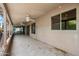 Covered back patio with tile flooring, ceiling fans, and sliding glass doors at 1505 Leisure World --, Mesa, AZ 85206