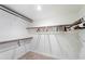 Large walk-in closet with ample shelving and hanging space at 1505 Leisure World --, Mesa, AZ 85206