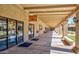 Covered walkway leading to community rooms, with benches alongside at 1505 Leisure World --, Mesa, AZ 85206