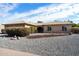 Single-story home with landscaped front yard and gravel driveway at 1505 Leisure World --, Mesa, AZ 85206