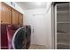 Convenient laundry room with washer, dryer, and shelving at 1505 Leisure World --, Mesa, AZ 85206