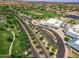 Aerial view of a school and park in a residential neighborhood with lush landscaping and mature trees at 15432 W Corrine Dr, Surprise, AZ 85379