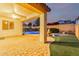 View of backyard featuring a water fountain and covered patio at 15432 W Corrine Dr, Surprise, AZ 85379