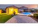 A backyard with grass, pool, and a fountain at 15432 W Corrine Dr, Surprise, AZ 85379