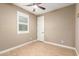 Bedroom with wood floors and a ceiling fan at 15432 W Corrine Dr, Surprise, AZ 85379