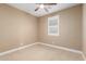 This bedroom features neutral walls, carpet flooring and a ceiling fan at 15432 W Corrine Dr, Surprise, AZ 85379