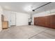 Garage with storage cabinets along the back wall at 15432 W Corrine Dr, Surprise, AZ 85379