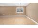 Living room featuring hardwood flooring, neutral walls, recessed lighting, and large window with shutters at 15432 W Corrine Dr, Surprise, AZ 85379