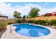 Beautiful pool with desert landscaping creating a private outdoor oasis in the backyard at 15432 W Corrine Dr, Surprise, AZ 85379