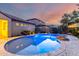 Backyard pool with desert landscaping creating a private outdoor oasis great for relaxing and entertaining at 15432 W Corrine Dr, Surprise, AZ 85379