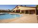 Poolside building features restrooms, showers, and nearby seating in a relaxing environment at 15432 W Corrine Dr, Surprise, AZ 85379