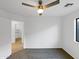 Bright bedroom with ceiling fan and carpet flooring at 1642 W La Salle St, Phoenix, AZ 85041