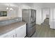 Modern kitchen with stainless steel appliances and breakfast bar at 1642 W La Salle St, Phoenix, AZ 85041