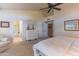 Well-lit bedroom with ensuite bathroom access and plush carpeting at 17045 N 58Th Way, Scottsdale, AZ 85254