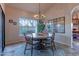 Charming dining area with a round table and wicker chairs at 17045 N 58Th Way, Scottsdale, AZ 85254