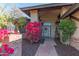 Welcoming entryway with brick pillars and vibrant flowers at 17045 N 58Th Way, Scottsdale, AZ 85254