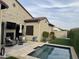 Relaxing backyard featuring a refreshing pool and patio seating area at 17395 W Guthrie St, Surprise, AZ 85388