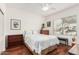 Guest bedroom with hardwood floors and built-in shelving at 18132 N Villa Bella Dr, Surprise, AZ 85374