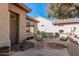 Private courtyard with green chairs and small plants at 18132 N Villa Bella Dr, Surprise, AZ 85374