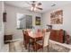 Dining room featuring a wooden table and chairs, and southwestern art at 18132 N Villa Bella Dr, Surprise, AZ 85374