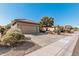 Single story house with attached garage and landscaping at 18132 N Villa Bella Dr, Surprise, AZ 85374