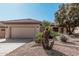 Tan house with brown tile roof and desert landscaping at 18132 N Villa Bella Dr, Surprise, AZ 85374