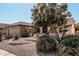 Single story house with landscaped yard and driveway at 18132 N Villa Bella Dr, Surprise, AZ 85374