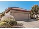 Single story house with attached garage and landscaping at 18132 N Villa Bella Dr, Surprise, AZ 85374