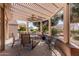 Relaxing patio with pergola, seating, and ceiling fan at 18132 N Villa Bella Dr, Surprise, AZ 85374