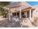 Covered patio with built-in seating and grill area at 18132 N Villa Bella Dr, Surprise, AZ 85374