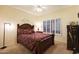 Guest bedroom with a wooden bed frame and window shutters at 18205 N Divet Ln, Surprise, AZ 85374