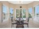 Bright breakfast nook with window seating and white plantation shutters at 18205 N Divet Ln, Surprise, AZ 85374