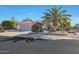 Single-story home with desert landscaping and a two-car garage at 18205 N Divet Ln, Surprise, AZ 85374