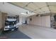 Spacious garage with built-in cabinets and golf cart at 18205 N Divet Ln, Surprise, AZ 85374