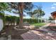 Landscaped backyard featuring a large tree and pergola at 1825 W Seldon Way, Phoenix, AZ 85021