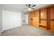 Spacious bedroom with built-in shelving and ceiling fan at 1825 W Seldon Way, Phoenix, AZ 85021