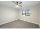 Bright bedroom with ceiling fan and carpet flooring at 1825 W Seldon Way, Phoenix, AZ 85021