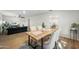 Light and airy dining area with a wooden table and seating for four at 1825 W Seldon Way, Phoenix, AZ 85021