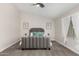 Spacious bedroom with gray upholstered bed and ceiling fan at 18825 N 34Th St, Phoenix, AZ 85050