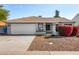 Single-story home with attached garage and red flowers at 18825 N 34Th St, Phoenix, AZ 85050