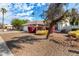 Single-story home with attached garage and mature tree at 18825 N 34Th St, Phoenix, AZ 85050