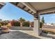 Covered porch with tile flooring and stone column at 18825 N 34Th St, Phoenix, AZ 85050