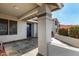 Covered porch with tile flooring and dark blue door at 18825 N 34Th St, Phoenix, AZ 85050