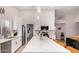 Modern kitchen with white cabinets, marble countertops, and a large island at 18825 N 34Th St, Phoenix, AZ 85050